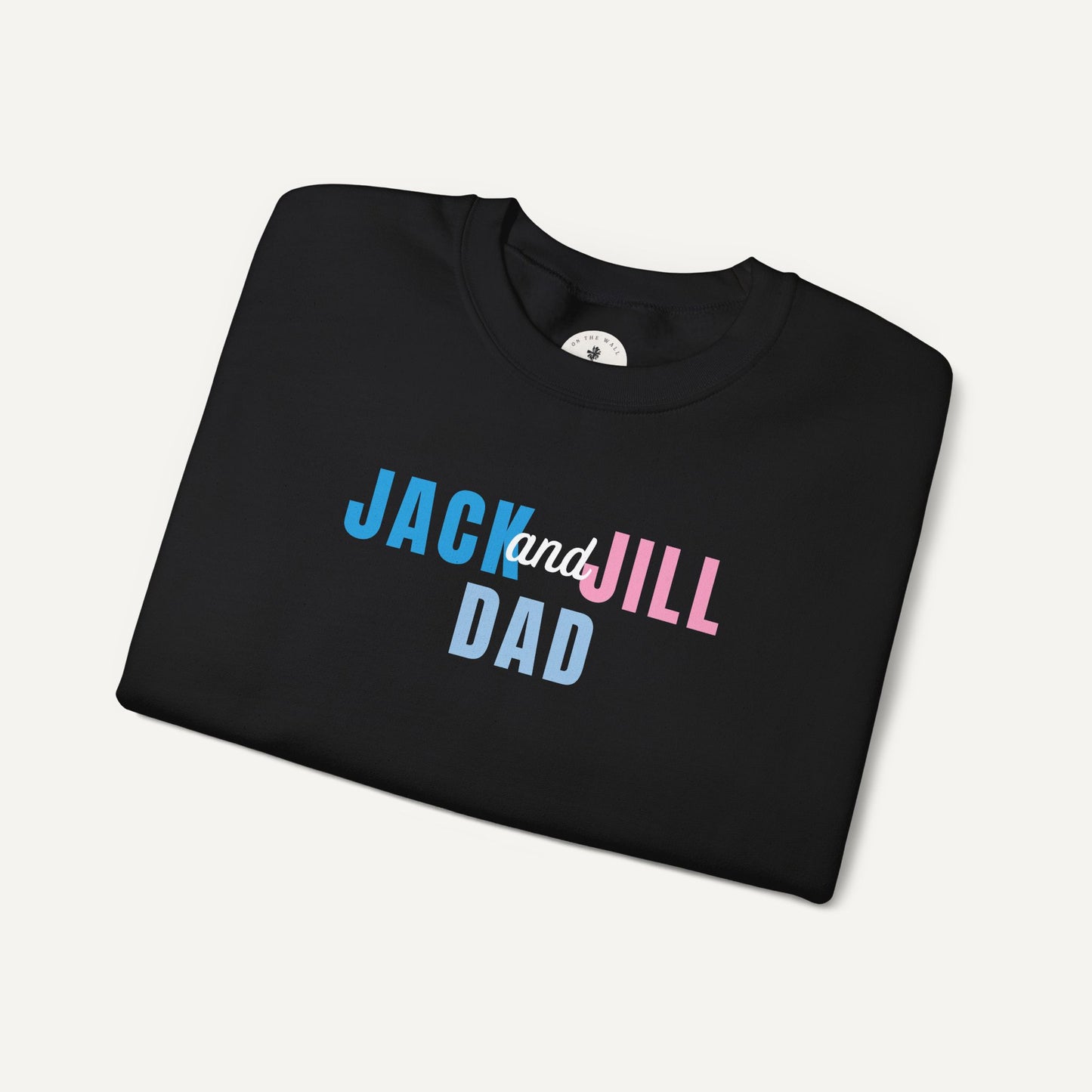 Folded black t-shirt with 'Jack and Jill Dad' text on a light gray background