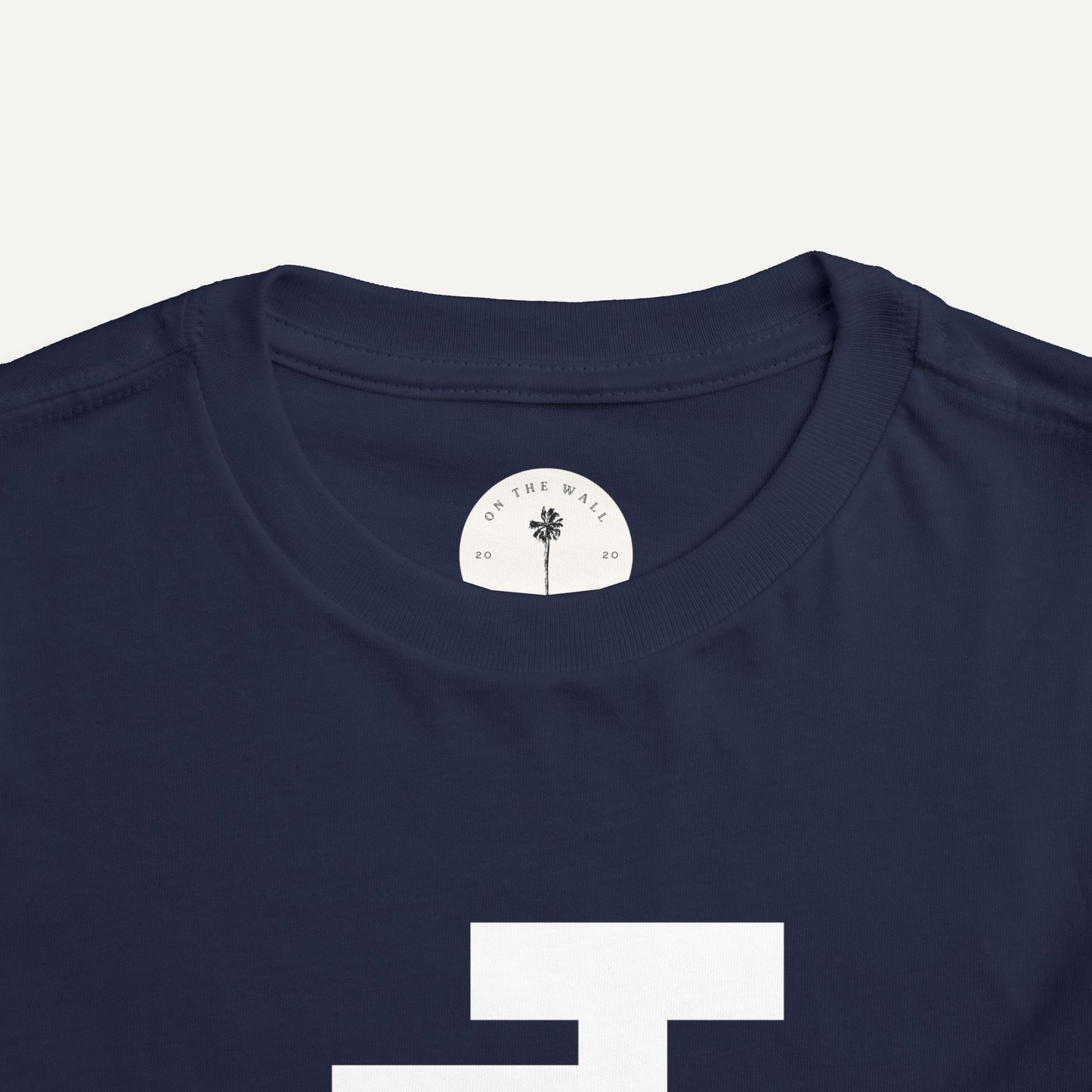 navy blue shirt with white JJ logo for jack and jill of america