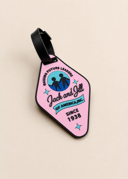 Pink luggage tag with 'Jack and Jill of America, Inc' branding on a beige background