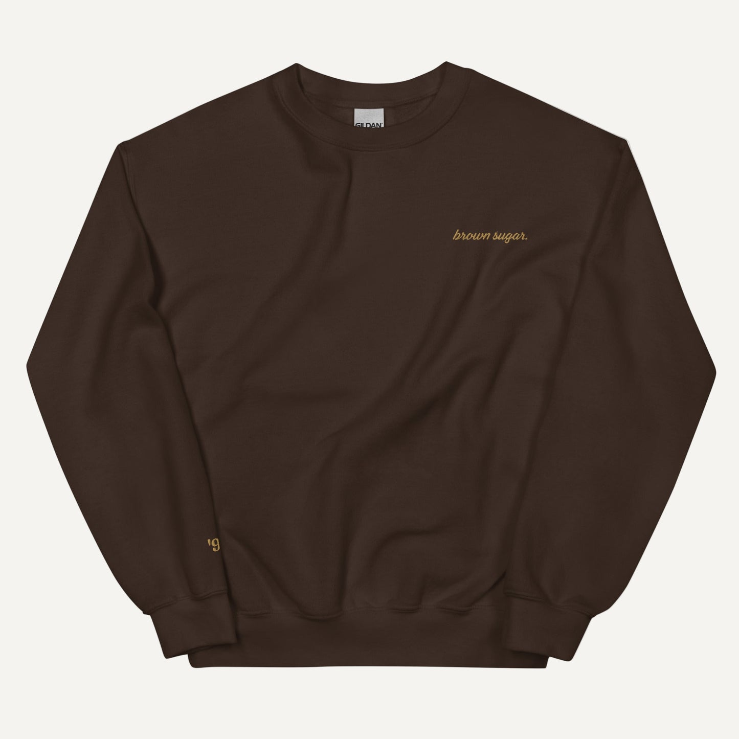chocolate brown sweatshirt with brown sugar embroidered on it in gild stitching