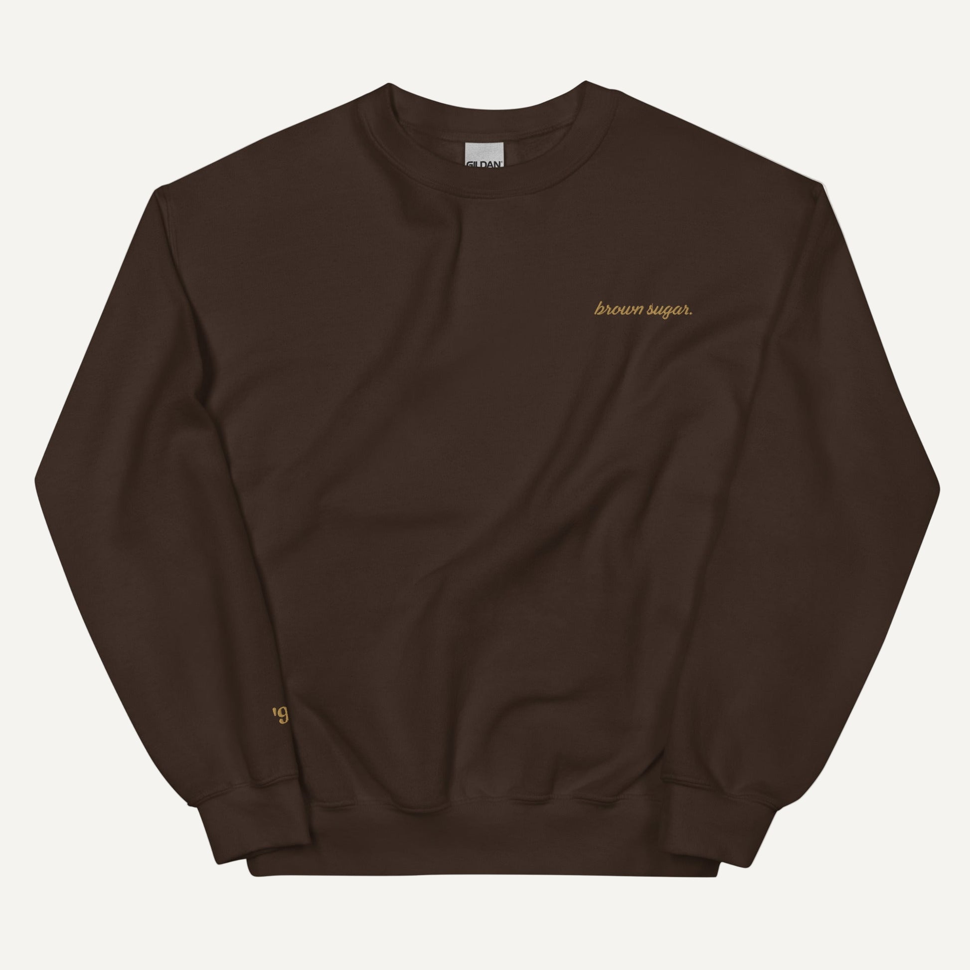 chocolate brown sweatshirt with brown sugar embroidered on it in gild stitching