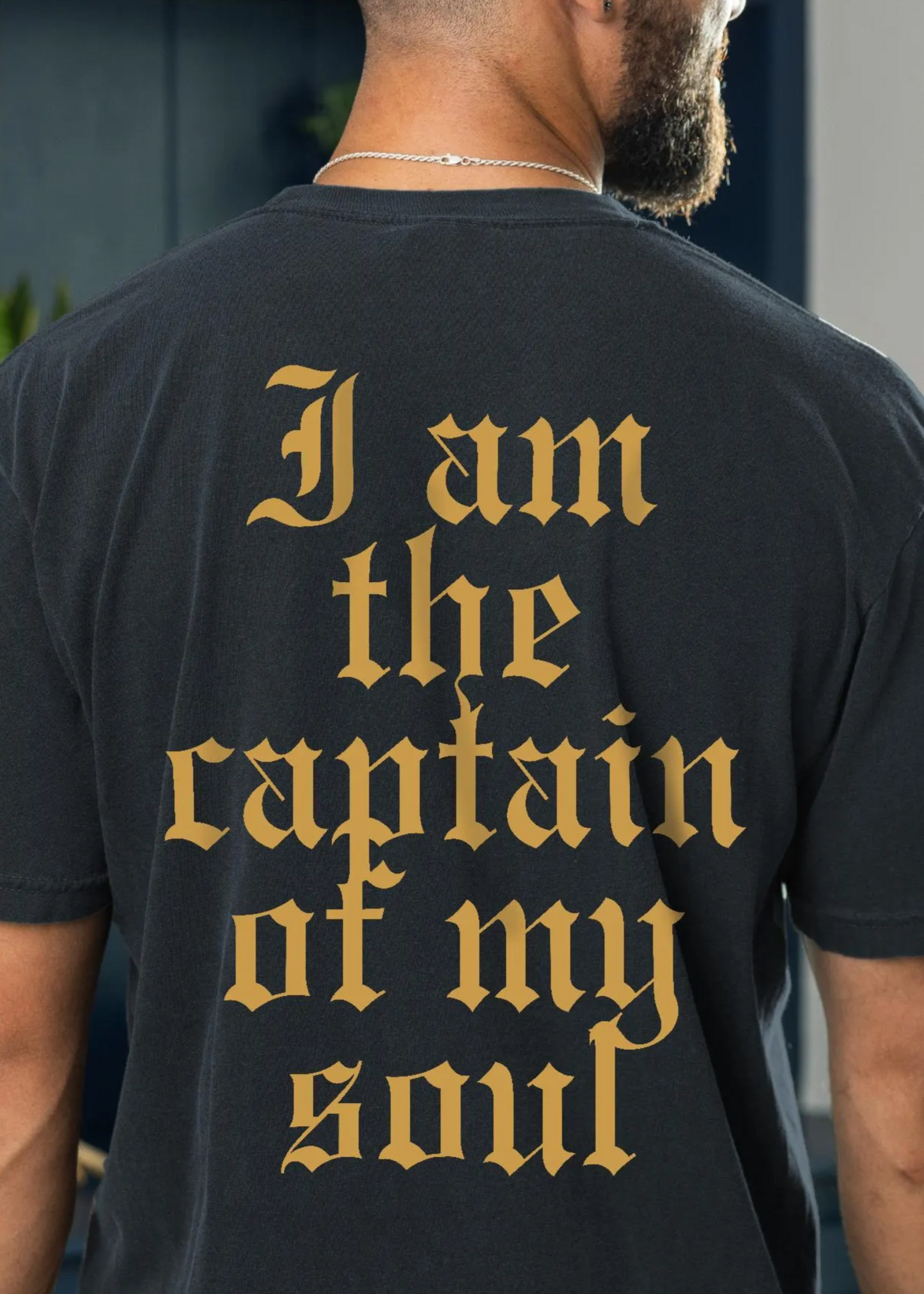 black and gold invictus shirt