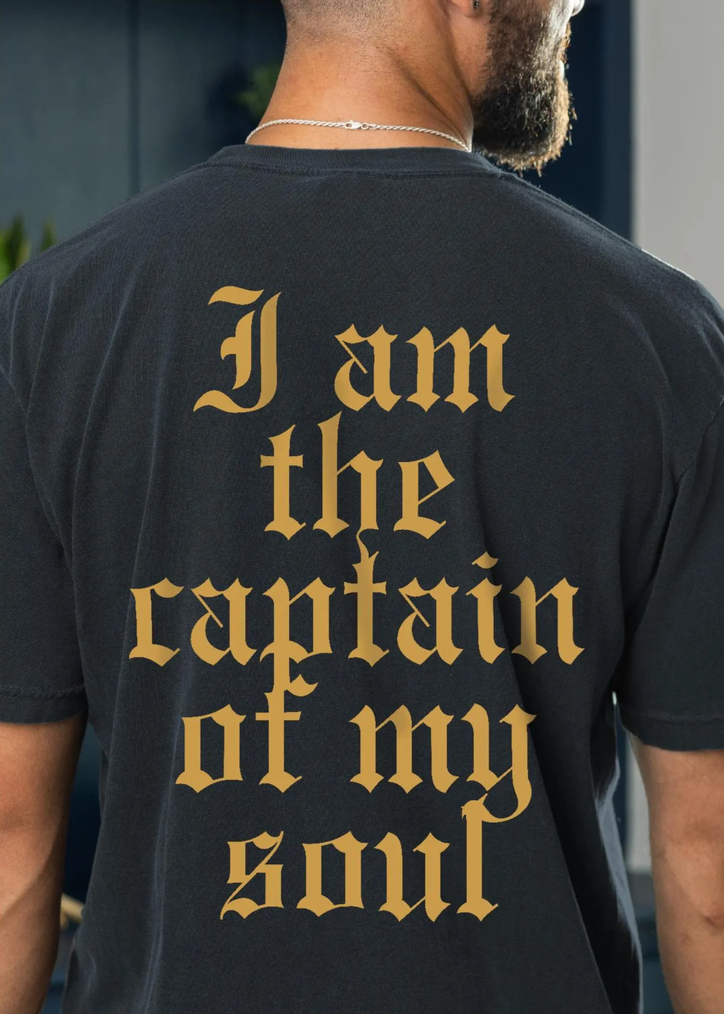 black and gold invictus shirt