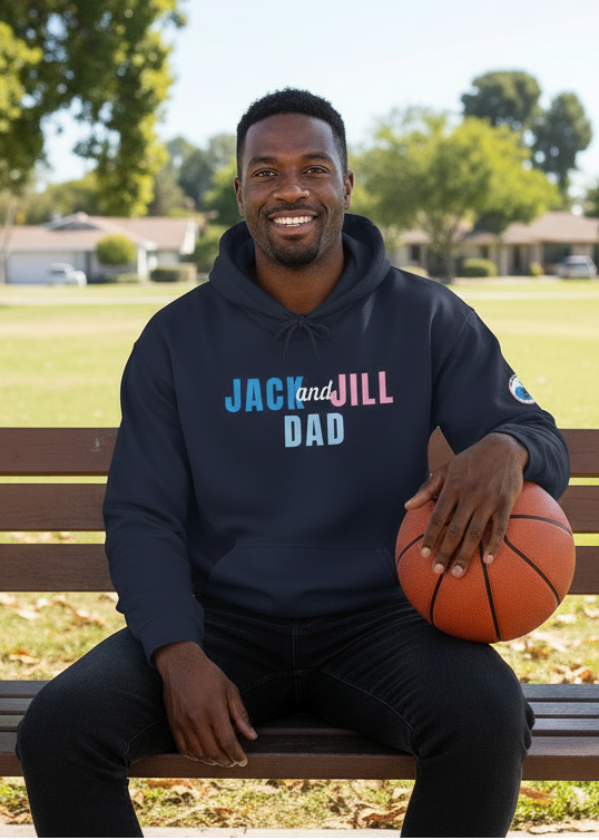Man sitting on a park bench holding a basketball, wearing a hoodie with 'Jack and Jill Dad' text.