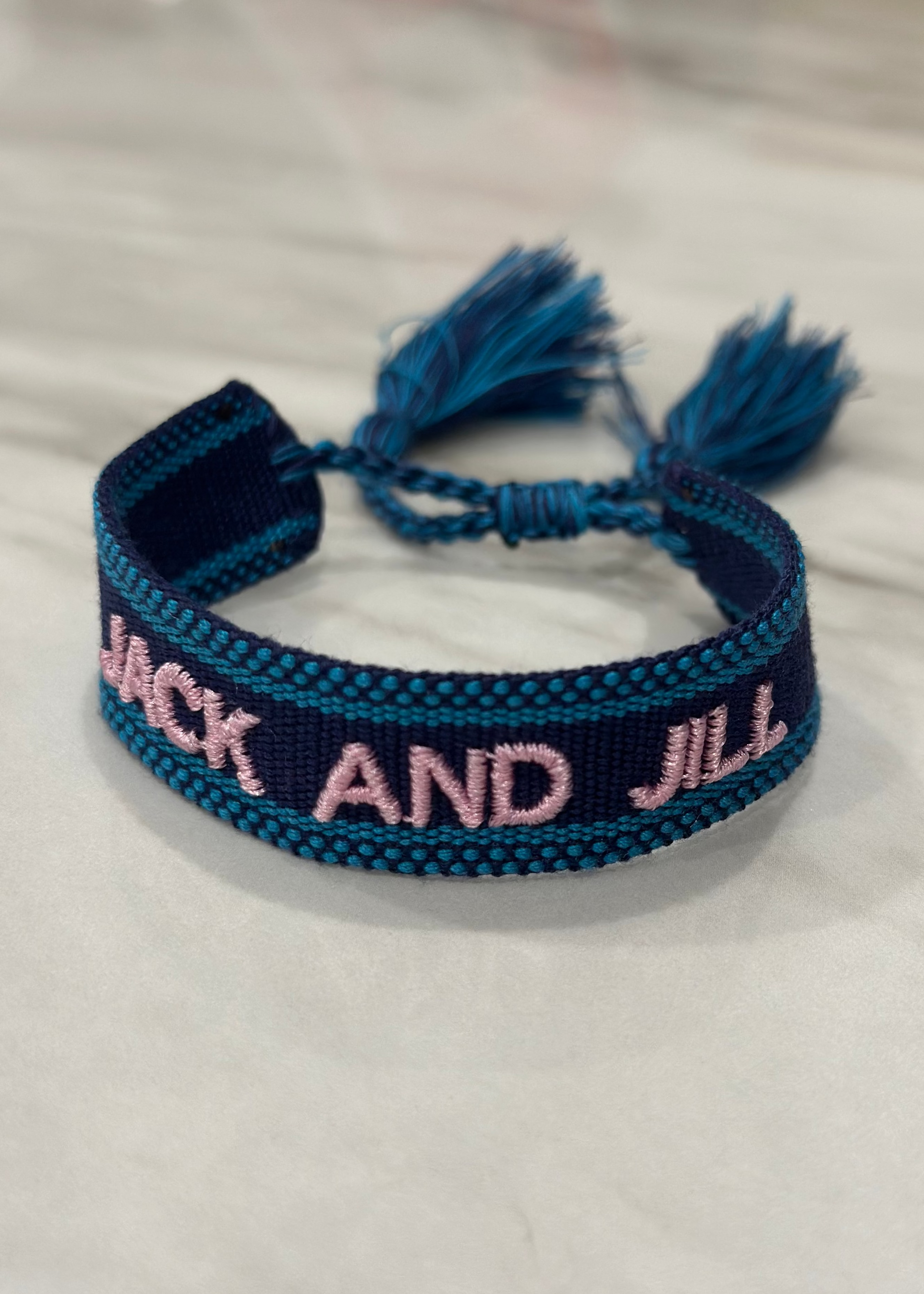 jack and jill of america navy blue woven bracelet with pink embroidery