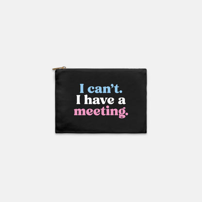 A black zippered pouch with a gold zipper pull and printed text reading 'I can't. I have a meeting for jack and jill of america mom gifts