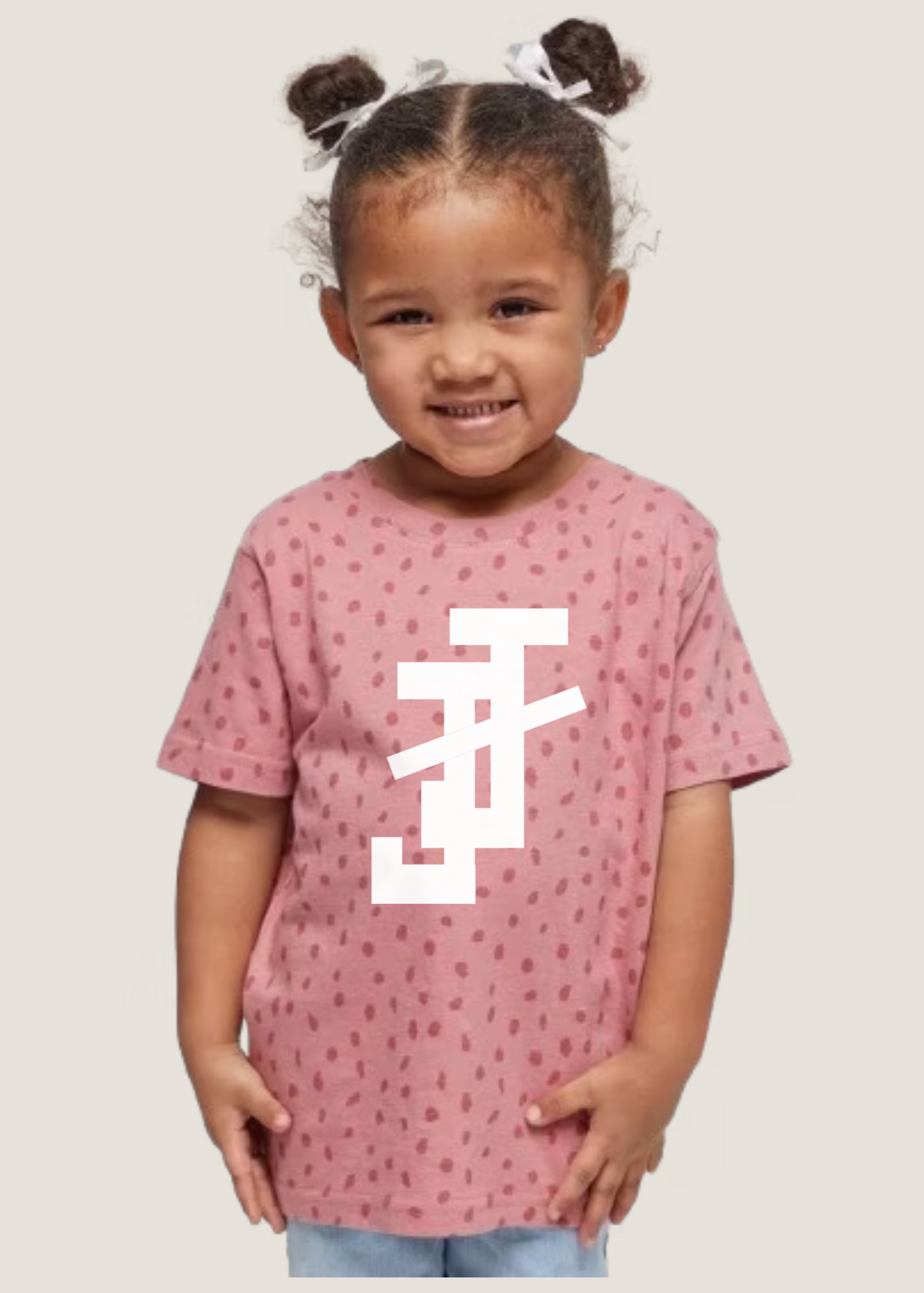jack and jill of america pink toddler shirt with dot print and white jj logo shown on toddler