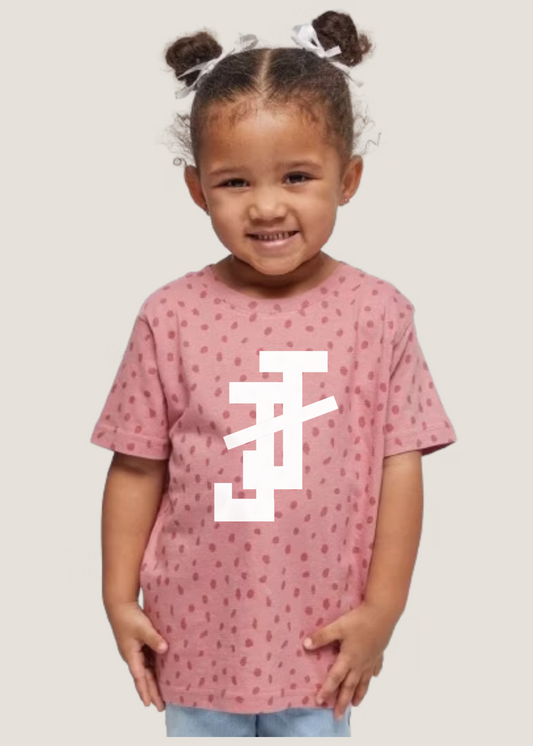 jack and jill of america pink toddler shirt with dot print and white jj logo shown on toddler