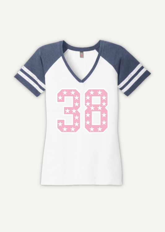 White v neck t-shirt with blue sleeves and pink star pattern on number 38