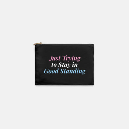 A black zipper pouch with a humorous quote printed on the front: 'Just Trying to Stay in Good Standing' in pink, white, and blue text. This is a gift for jack and jill moms as a jack and jill cosmentic pouch. makeup bag, pencil case or tech case.