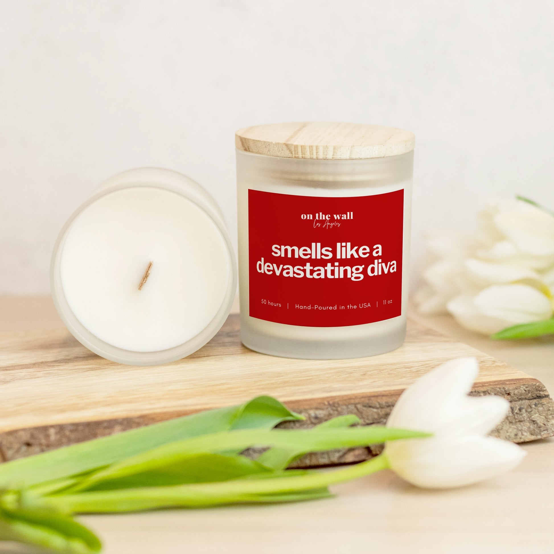 smells like a devastating diva candle - red and white crossing gift